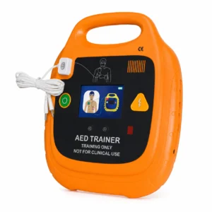 Orange AED trainer device with built‑in screen and wired cables, labeled for training only, not for clinical use.