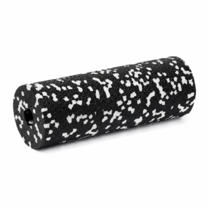 Black and white speckled foam roller resting on a white background, cylindrical exercise tool for muscle release and stretching.