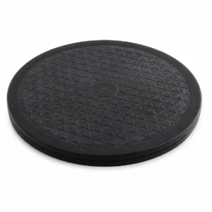 Round black circular platform with a textured diamond grid surface and a slightly raised edge (non-slip base).