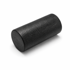 Black textured foam roller on a white background used for muscle massage and fitness warmups