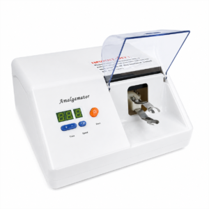 White dental amalgamator machine with a transparent lid, digital display, and blue control buttons labeled Time and Speed — Amalgamator top view on white background.