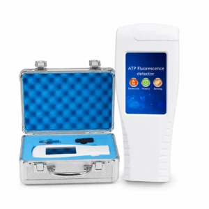 Portable ATP fluorescence detector (handheld) beside an open silver case with blue foam, used for surface cleanliness testing.