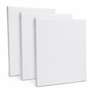 Three blank white canvases standing upright in a row, slightly angled toward the viewer