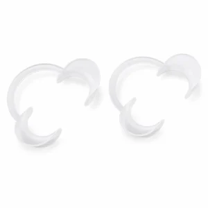 Two clear crescent-shaped dental mouth guards on a white background.