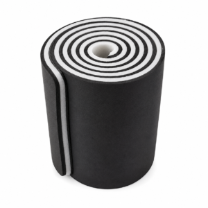 Rolled black foam yoga mat with white edges, viewed from above.