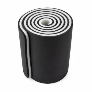 Rolled black foam yoga mat with white edges, viewed from above.