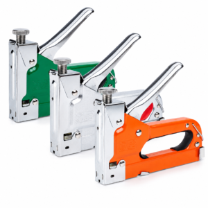 Three metal staple guns in orange and green colors arranged diagonally on a white background.
