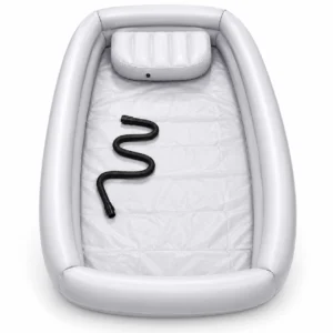 Gray inflatable boat interior with a black spiral air hose laid along the floor