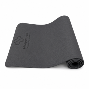 Dark gray textured exercise mat, partially rolled, with a brand logo visible on the surface.