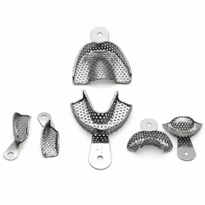 Set of perforated stainless steel dental mouthguards and mounting pieces arranged on a white background.