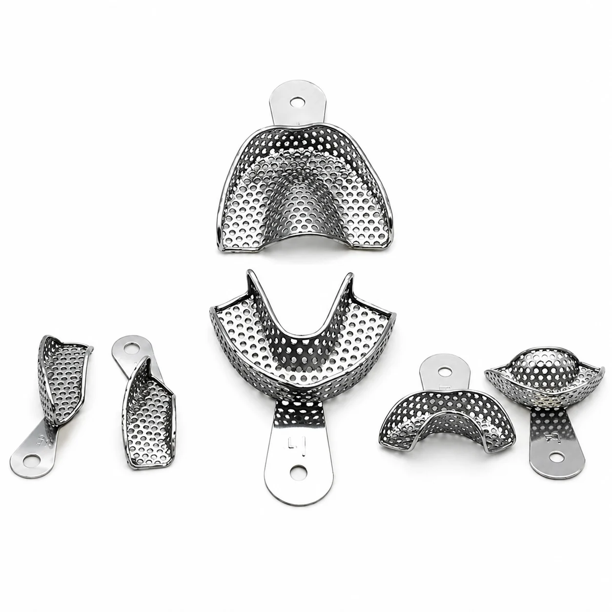 Set of perforated stainless steel dental mouthguards and mounting pieces arranged on a white background.