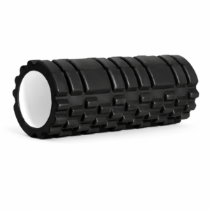 Black textured foam roller for muscle massage and myofascial release on a white background