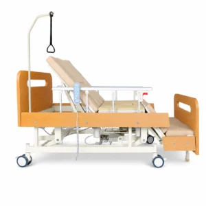 Adjustable hospital bed with wooden headboard/footboard, side rails, wheels, and an overhead trapeze bar.